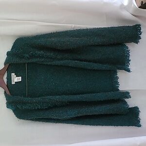 A teal and orange  shrug size L hook closure